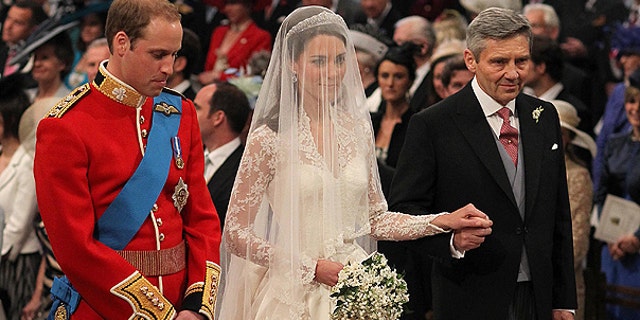 April 29: Britain's Prince William and Kate Middleton, centre, stand at the altar during the service along with Kate's father Michael Middleton.