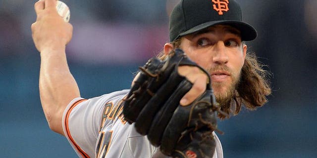 Apr 28, 2015; Los Angeles, CA, USA; San Francisco Giants starting pitcher Madison Bumgarner (40) throws in the first inning against the Los Angeles Dodgers at Dodger Stadium. Mandatory Credit: Jayne Kamin-Oncea-USA TODAY Sports