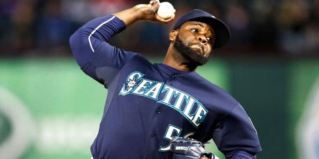 Apr 28, 2015; Arlington, TX, USA; Seattle Mariners relief pitcher Fernando Rodney (56) delivers a pitch to the Texas Rangers during the ninth inning of a baseball game at Globe Life Park in Arlington. The Mariners won 2-1. Mandatory Credit: Jim Cowsert-USA TODAY Sports