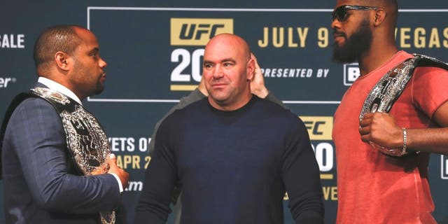 NEW YORK, NY - APRIL 27: UFC president Dana White stars between Daniel Cormier (L) and Jon Jones as they square off during a media availability for UFC 200 at Madison Square Garden on April 27, 2016 in New York City. (Photo by Jeff Zelevansky/Getty Images)