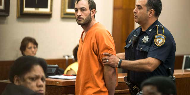 April 29, 2015: Blaine Boudreaux is escorted from the courtroom.