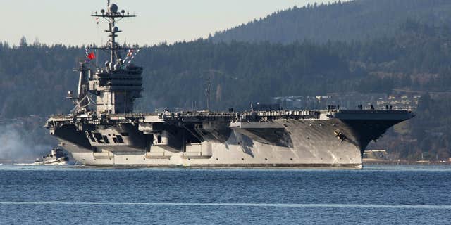Dec. 1, 2014: FILE - In this photo Dec. 1, 2014 file photo, the aircraft carrier USS John Stennis seen near Bremerton, Wash.