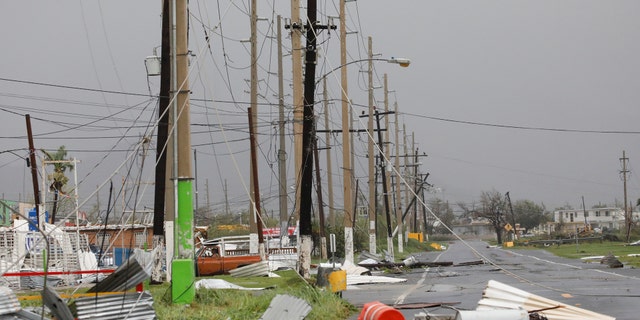 Debris and damaged electrical installations are seen after the area was hit by Hurricane Maria en Guayama, Puerto Rico September 20, 2017.
