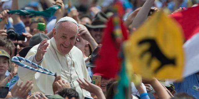 Pope Francis is cheered by the crowd as he arrives for an audience with Italian AGESCI boy scouts association's members in St. Peter's Square at the Vatican, Saturday, June 13, 2015. (AP Photo/Alessandra Tarantino)
