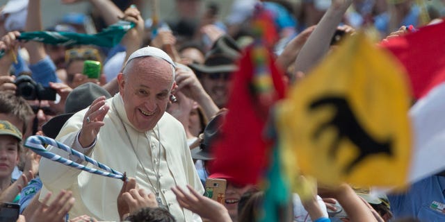 Pope Francis is cheered by the crowd as he arrives for an audience with Italian AGESCI boy scouts association's members in St. Peter's Square at the Vatican, Saturday, June 13, 2015. (AP Photo/Alessandra Tarantino)