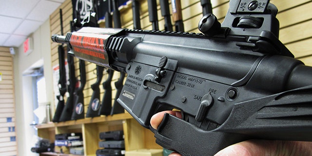 In this Feb. 1, 2013, file photo, an employee of North Raleigh Guns demonstrates how a "bump" stock works at the Raleigh, N.C., shop. Lawmakers could now consider banning the devices in the wake of the Las Vegas shooting.
