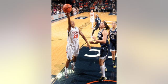 Virginia guard Faith Randolph (20) shoots next to Notre Dame forward Natalie Achonwa during the first half of an NCAA college basketball game on Sunday, Jan. 12, 2014, in Charlottesville, Va. Notre Dame defeated Virginia  79-72. (AP Photo/Andrew Shurtleff)