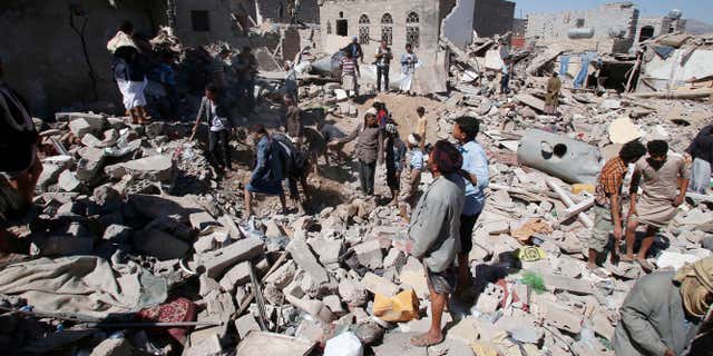 May 1, 2015: People search for survivors under the rubble of houses destroyed by Saudi-led airstrikes in Sanaa, Yemen.