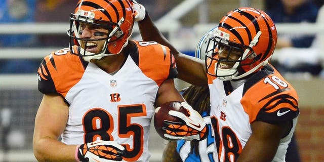 Oct 20, 2013; Detroit, MI, USA; Cincinnati Bengals wide receiver A.J. Green (18) congratulates tight end Tyler Eifert (85) after catching a pass for a touchdown during the third quarter against the Detroit Lions at Ford Field. Mandatory Credit: Andrew Weber-USA TODAY Sports