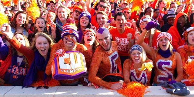 Nov 29, 2014; Clemson, SC, USA; Clemson Tigers fans celebrate during the fourth quarter of the game against the South Carolina Gamecocks at Clemson Memorial Stadium. Tigers won 35-17. Mandatory Credit: Joshua S. Kelly-USA TODAY Sports