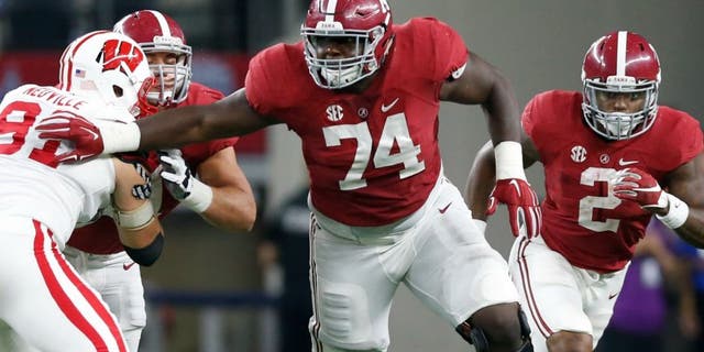 Sep 5, 2015; Arlington, TX, USA; Alabama Crimson Tide tackle Cam Robinson (74) in action against the Wisconsin Badgers at AT&T Stadium. Mandatory Credit: Matthew Emmons-USA TODAY Sports