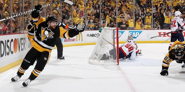 PITTSBURGH, PA - MAY 2: Phil Kessel #81 of the Pittsburgh Penguins celebrates a goal by Carl Hagelin #62 during the second period against the Washington Capitals in Game Three of the Eastern Conference Second Round during the 2016 NHL Stanley Cup Playoffs at Consol Energy Center on May 2, 2016 in Pittsburgh, Pennsylvania. (Photo by Gregory Shamus/NHLI via Getty Images)
