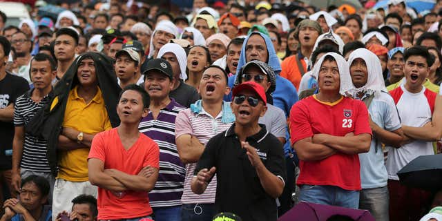 May 3, 2015: Filipinos watch a live satellite feed of the welterweight title fight between Filipino boxing hero Manny Pacquiao and Floyd Mayweather Jr. during a free public viewing in downtown Manila, Philippines.