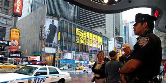 May 3, 2010: A New York City police officer stands watch on Times Square in the wake of a car bomb attempt carried out by a Pakistani-American man.