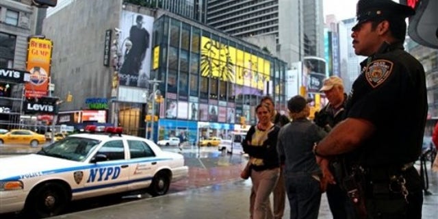 May 3, 2010: A New York City police officer stands watch on Times Square in the wake of a car bomb attempt carried out by a Pakistani-American man.
