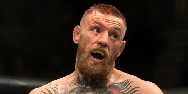 LAS VEGAS, NV - MARCH 5: Conor McGregor mocks Nate Diaz in their welterweight bout during the UFC 196 in the MGM Grand Garden Arena on March 5, 2016 in Las Vegas, Nevada. (Photo by Brandon Magnus/Zuffa LLC/Zuffa LLC via Getty Images)