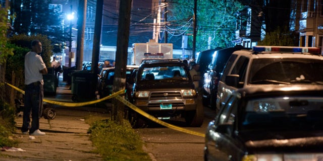 May 4: Police vehicles fill a street as officers search the home of the suspected Times Square bomber in Bridgeport, Conn.