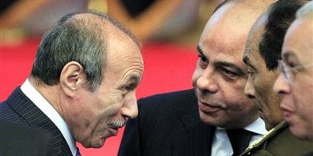 Egyptian Interior Minister Habib al-Adly, left, talks to minister of defense and military production, Field Marshal Hussein Tantawi, second right, during the National democratic party conference in Cairo, Egypt, in this Saturday Dec. 25, 2010 file photo.