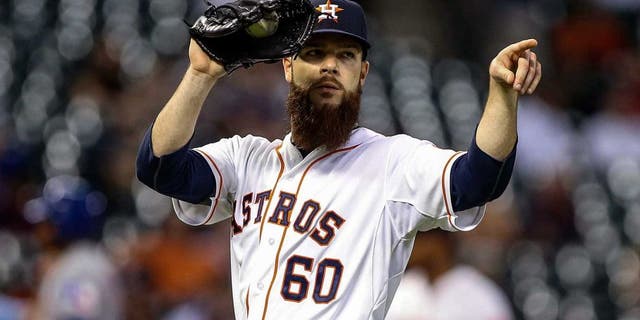 May 4, 2015; Houston, TX, USA; Houston Astros starting pitcher Dallas Keuchel (60) points to first baseman Chris Carter (not pictured) after a play during the fifth inning against the Texas Rangers at Minute Maid Park. Mandatory Credit: Troy Taormina-USA TODAY Sports