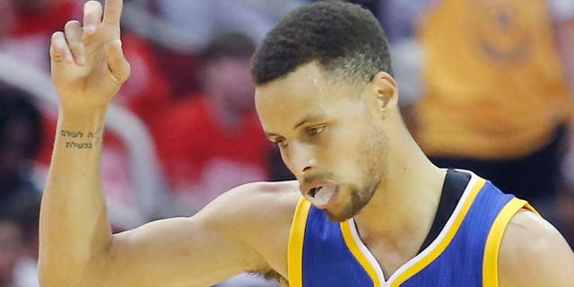 Golden State Warriors guard Stephen Curry (30) reacts after making a three point basket against the Houston Rockets in the second quarter in game four of the first round of the NBA Playoffs at Toyota Center. Mandatory Credit: Thomas B. Shea-USA TODAY Sports