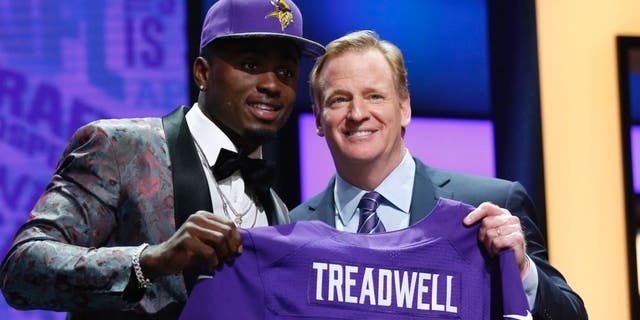 Apr 28, 2016; Chicago, IL, USA; Laquon Treadwell (Mississippi) with NFL commissioner Roger Goodell after being selected by the Minnesota Vikings as the number twenty-three overall pick in the first round of the 2016 NFL Draft at Auditorium Theatre. Mandatory Credit: Kamil Krzaczynski-USA TODAY Sports