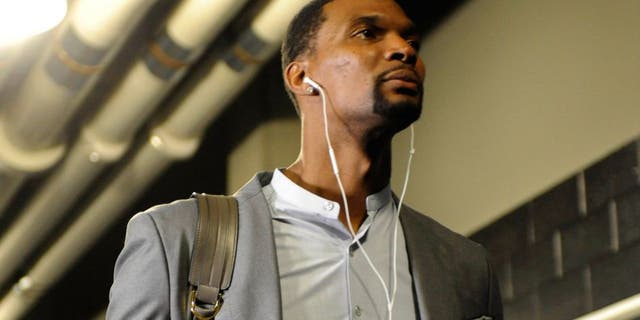 Apr 29, 2016; Charlotte, NC, USA; Miami Heat forward Chris Bosh (1) arrives to to the arena before game six of the first round of the NBA Playoffs against the Charlotte Hornets at Time Warner Cable Arena. Mandatory Credit: Sam Sharpe-USA TODAY Sports