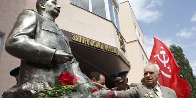 May 5: A World War Two veteran lays flowers at the monument of Soviet dictator Josef Stalin after an unveiling ceremony in the Ukrainian city of Zaporozhye, 300 miles southeast of the capital of Kiev.