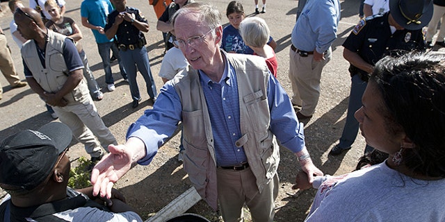 April 28: Alabama Gov. Robert Bentley visits with residents in Tuscaloosa, Ala., who lost their homes in a tornado strike.