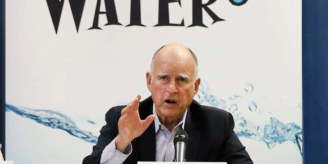 April 16, 2015: California Gov. Jerry Brown talks with reporters after a meeting about the drought at his Capitol office in Sacramento, Calif.