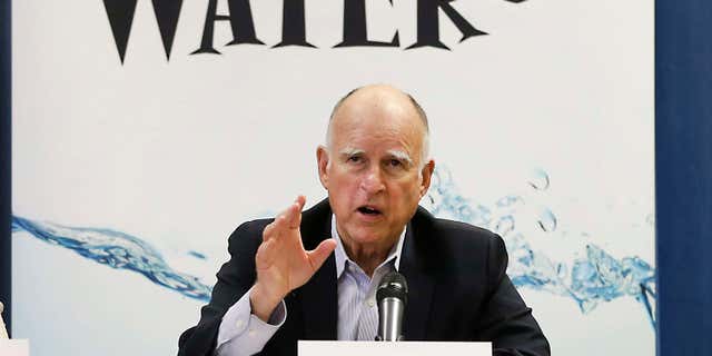April 16, 2015: California Gov. Jerry Brown talks with reporters after a meeting about the drought at his Capitol office in Sacramento, Calif.