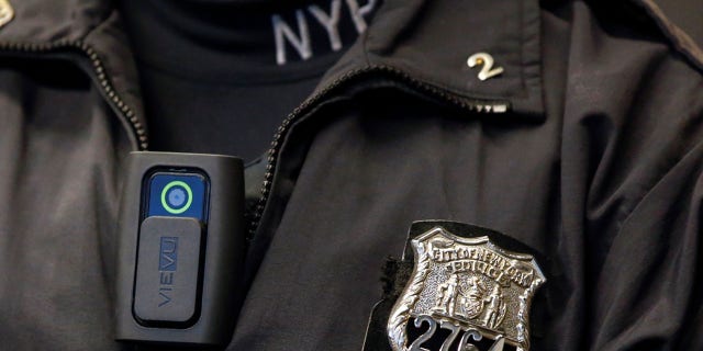 FILE PHOTO - A police body camera is seen on an officer during a news conference on the pilot program of body cameras involving 60 NYPD officers dubbed 'Big Brother' at the NYPD police academy in the Queens borough of New York, December 3, 2014. REUTERS/Shannon Stapleton/File Photo - RTX2Z30U