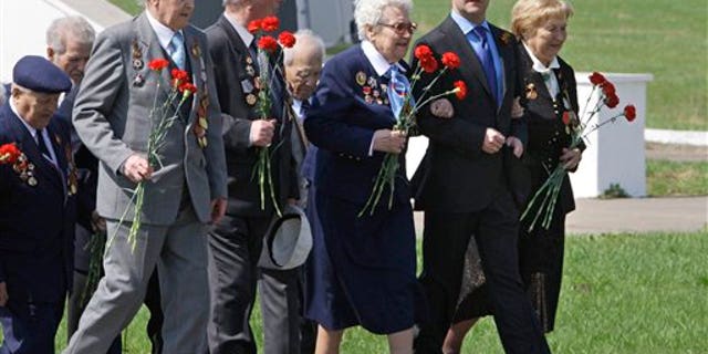 May 7: Russian President Dmitry Medvedev, second right, walks with World War II veterans to lay flowers at the monument to Soviet soldiers killed fighting Nazi troops in Nov. 1941, near Volokolamsk, 62.5 miles west of Moscow. Russia will celebrate its victory in WWII on May 9.