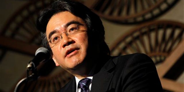 May 7: Nintendo Co. President Satoru Iwata speaks during a press briefing in Tokyo. Iwata said anti-piracy measures will be beefed up in its upcoming 3-D handheld gaming device. The Japanese game-maker of Super Mario and Pokemon has said it will unveil the new device at the E3 trade show in Los Angeles next month.