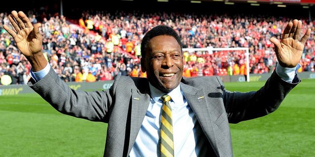 LIVERPOOL, ENGLAND - MARCH 22: (THE SUN OUT, THE SUN ON SUNDAY OUT) Pele comes onto the pitch at half time of the Barclays Premier League match between Liverpool and Manchester Untied at Anfield on March 22, 2015 in Liverpool, England. (Photo by John Powell/Liverpool FC via Getty Images)