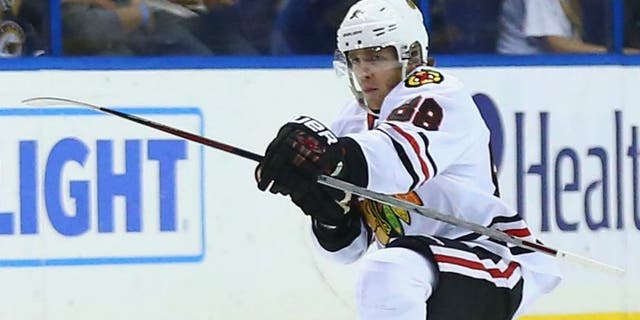 ST. LOUIS, MO - APRIL 21: Patrick Kane #88 of the Chicago Blackhawks celebrates after scoring the game-winning goal against the St. Louis Blues in Game Five of the Western Conference First Round during the 2016 NHL Stanley Cup Playoffs at the Scottrade Center on April 21, 2016 in St. Louis, Missouri. The Blackhawks beat the Blues 4-3 in double overtime. (Photo by Dilip Vishwanat/ Getty Images)