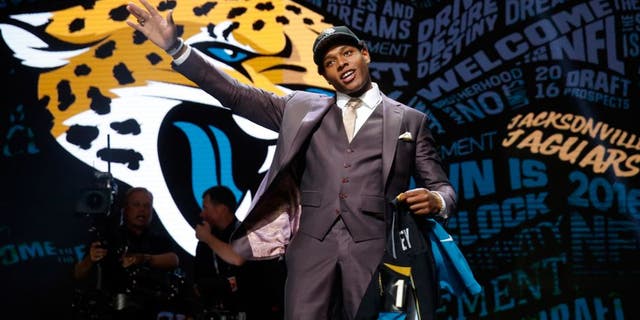 Florida Stateâs Jalen Ramsey poses for photos after being selected by Jacksonville Jaguars as fifth pick in the first round of the 2016 NFL football draft, Thursday, April 28, 2016, in Chicago. (AP Photo/Charles Rex Arbogast)