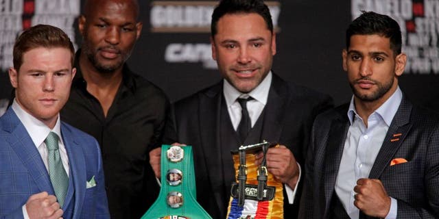 CORRECTION - Boxer Saul 'Canelo' Alvarez from Mexico (L), Bernard Hopkins, Oscar De La Hoya and England's Amir Khan (R) poses together with the WBC Middleweight belt during their final press conference at the MGM Grand in Las Vegas, Nevada on May 4, 2016 . The boxers will fight for the WBC Middleweight title on May 7, 2016 at the T-Mobile Arena in Las Vegas. / AFP / John Gurzinski / The erroneous mention[s] appearing in the metadata of this photo by John Gurzinski has been modified in AFP systems in the following manner: [Middleweight] instead of [Welterweight]. Please immediately remove the erroneous mention[s] from all your online services and delete it (them) from your servers. If you have been authorized by AFP to distribute it (them) to third parties, please ensure that the same actions are carried out by them. Failure to promptly comply with these instructions will entail liability on your part for any continued or post notification usage. Therefore we thank you very much for all your attention and prompt action. We are sorry for the inconvenience this notification may cause and remain at your disposal for any further information you may require. (Photo credit should read JOHN GURZINSKI/AFP/Getty Images)