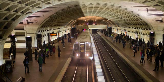 FILE - In this Jan. 13, 2015 file photo, a subway train arrives at the L'Enfant Metro Station in Washington.
