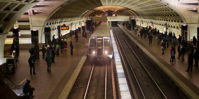 FILE - In this Jan. 13, 2015 file photo, a subway train arrives at the L'Enfant Metro Station in Washington.