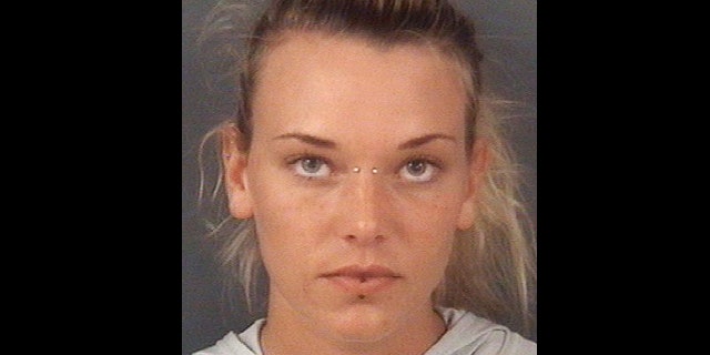In this undated photo released by the Cumberland County Sheriff's Office, in Fayetteville, N.C., Marinna Rollins, poses for a photo.