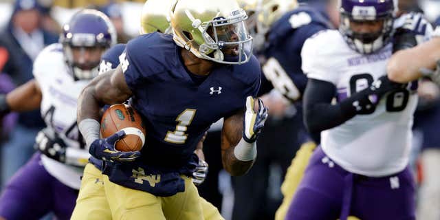In this Nov. 15, 2014, file photo, Notre Dame running back Greg Bryant (1) runs with the ball against Northwestern during the first half of an NCAA college football game in South Bend, Ind.