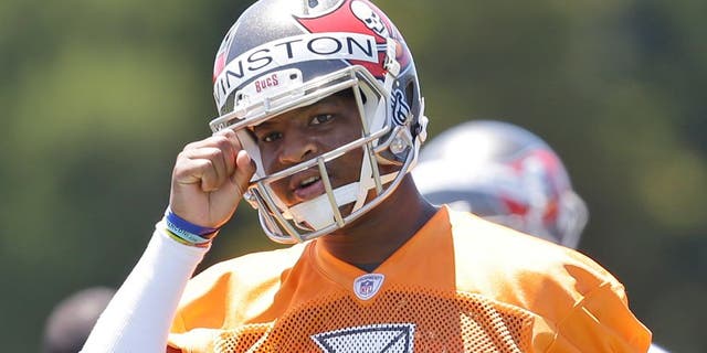 Tampa Bay Buccaneers quarterback Jameis Winston calls out a play during drills in an NFL rookie minicamp in Tampa, Fla., Friday, May 8, 2015. (AP Photo/Wilfredo Lee)