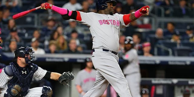 NEW YORK, NY - MAY 08: David Ortiz #34 of the Boston Red Sox connects on a solo home run in the fourth inning against the New York Yankees at Yankee Stadium on May 8, 2016 in the Bronx borough of New York City. (Photo by Mike Stobe/Getty Images)