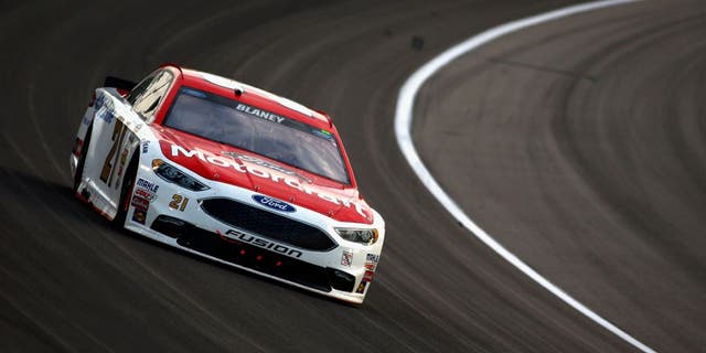 KANSAS CITY, KS - MAY 07: Ryan Blaney, driver of the #21 Motorcraft/Quick Lane Tire & Auto Center Ford, races during the NASCAR Sprint Cup Series Go Bowling 400 at Kansas Speedway on May 7, 2016 in Kansas City, Kansas. (Photo by Jamie Squire/Getty Images)