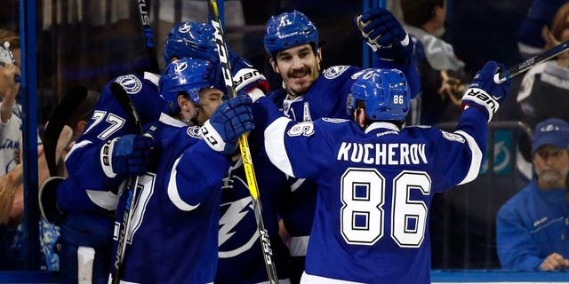 May 8, 2016; Tampa, FL, USA; Tampa Bay Lightning defenseman Victor Hedman (77) is congratulated by right wing Nikita Kucherov (86) and teammates after scored a goal against the New York Islanders during the second period in game five of the second round of the 2016 Stanley Cup Playoffs at Amalie Arena. Mandatory Credit: Kim Klement-USA TODAY Sports