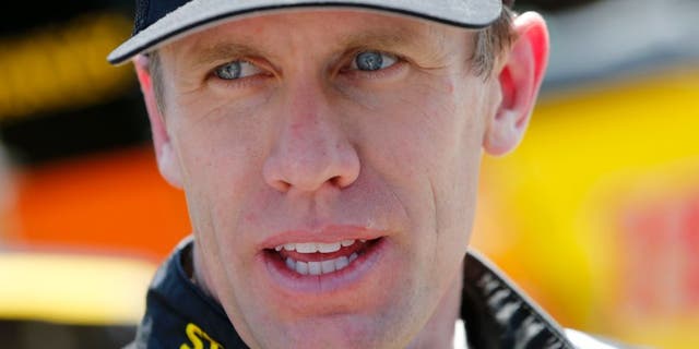 KANSAS CITY, KS - MAY 06: Carl Edwards, driver of the #19 Stanley Toyota, looks on during practice for the NASCAR Sprint Cup Series Go Bowling 400 at Kansas Speedway on May 6, 2016 in Kansas City, Kansas. (Photo by Brian Lawdermilk/Getty Images)