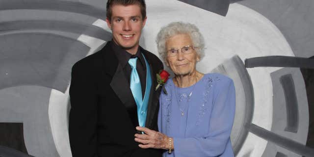 This photo provided by Inter-State Studio & Publishing Co. Shows Drew Holm and his great-grandmother Kathryn Keith in their prom picture.