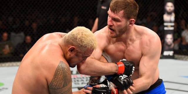 ADELAIDE, AUSTRALIA - MAY 10: (R-L) Stipe Miocic elbows Mark Hunt in their heavyweight bout during the UFC Fight Night event at the Adelaide Entertainment Centre on May 10, 2015 in Adelaide, Australia. (Photo by Josh Hedges/Zuffa LLC/Zuffa LLC via Getty Images)
