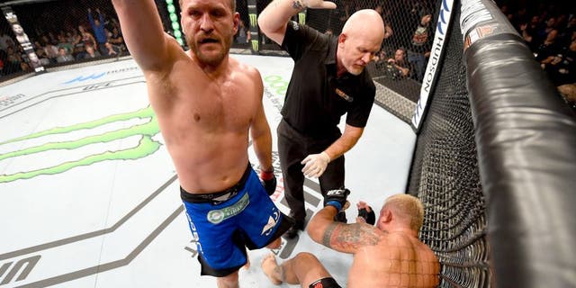 ADELAIDE, AUSTRALIA - MAY 10: (L-R) Stipe Miocic celebrates his TKO victory over Mark Hunt in their heavyweight bout during the UFC Fight Night event at the Adelaide Entertainment Centre on May 10, 2015 in Adelaide, Australia. (Photo by Josh Hedges/Zuffa LLC/Zuffa LLC via Getty Images)