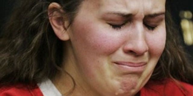 In this April 14, 2009 file photo, Melissa Huckaby, 28, listens in a Stockton, Calif., courtroom during her arraignment. The Tracy Sunday school teacher has been sentenced to life in prison for kidnapping and murdering her 8-year-old neighbor.